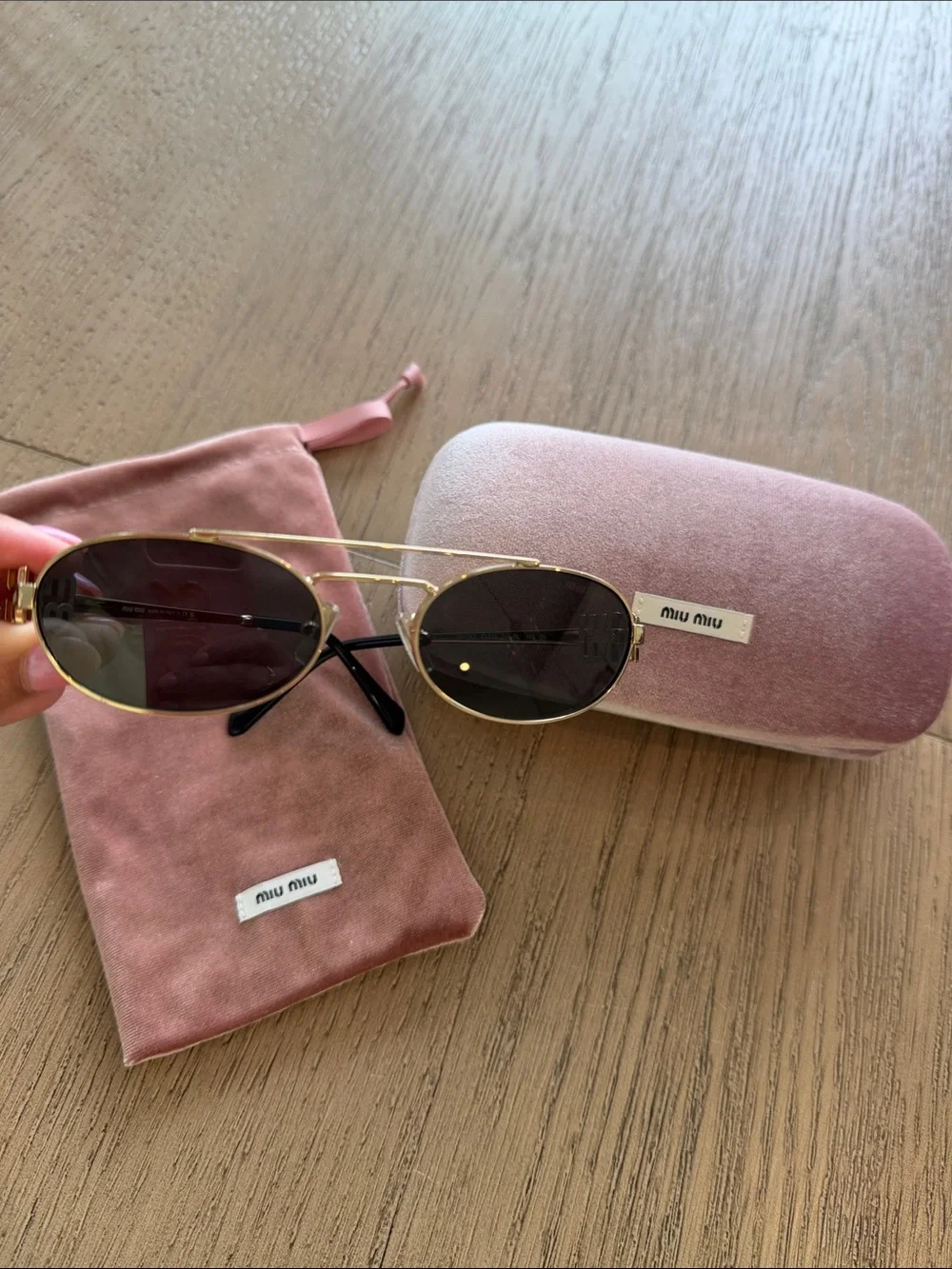 Miu Miu Gold Frame Oval Sunglasses with Dark Lenses and Pink Case/Pouch